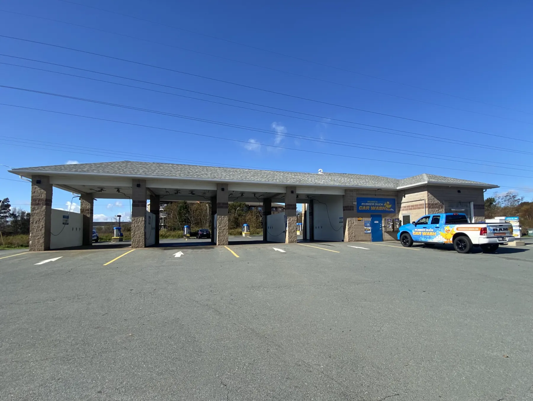 The Highfield Park Rubber Duck Car Wash: the duck sign, the branded truck, and the self-serve bays
